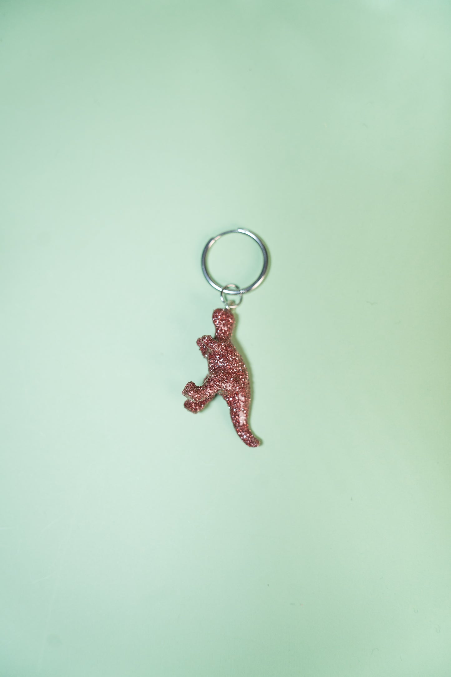 Mono boucle - Mini dinosaure paillettes roses (Tyranosaure)