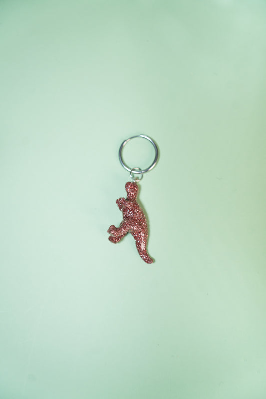 Mono boucle - Mini dinosaure paillettes roses (Tyranosaure)