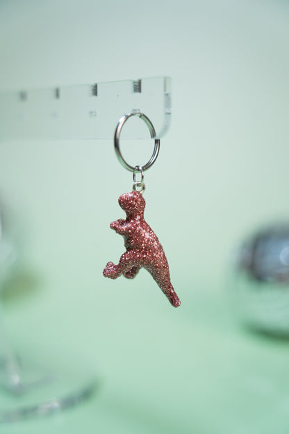 Mono boucle - Mini dinosaure paillettes roses (Tyranosaure)