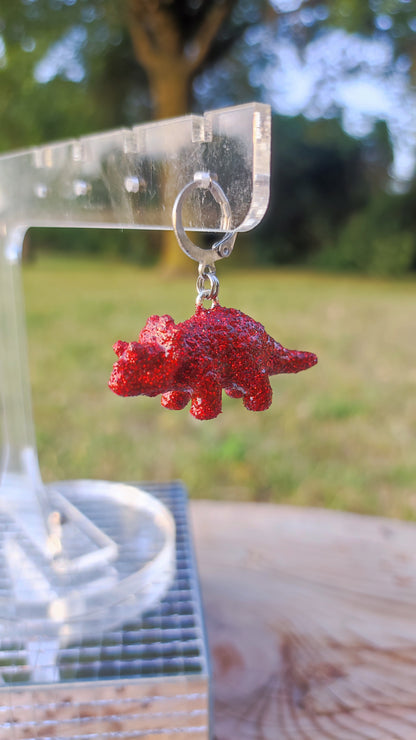 Mono boucle  - Mini dinosaure paillettes rouges (Triceratops)