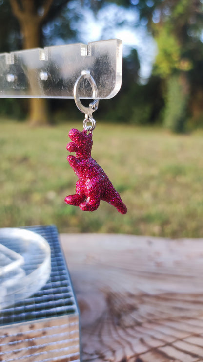 Mono boucle  - Mini dinosaure paillettes roses fuchsia (T-rex)