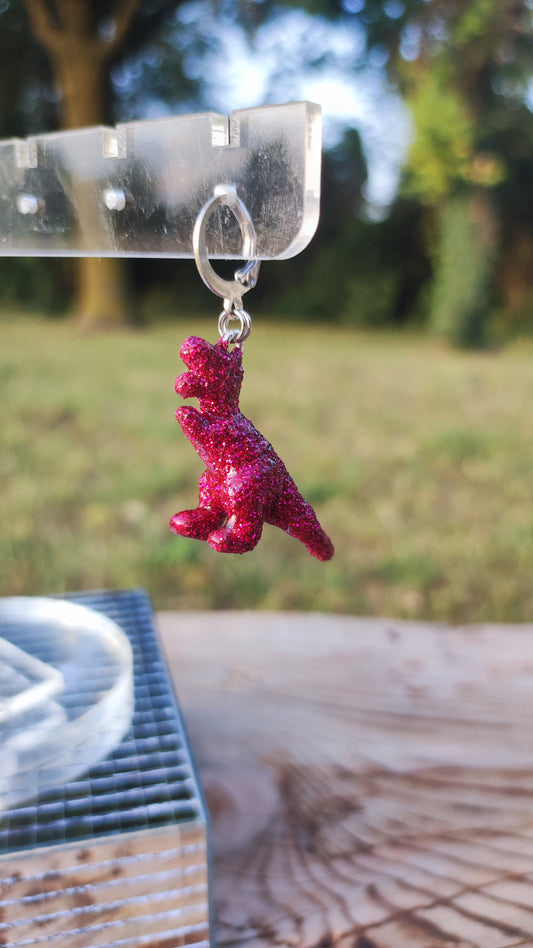 Mono boucle  - Mini dinosaure paillettes roses fuchsia (T-rex)