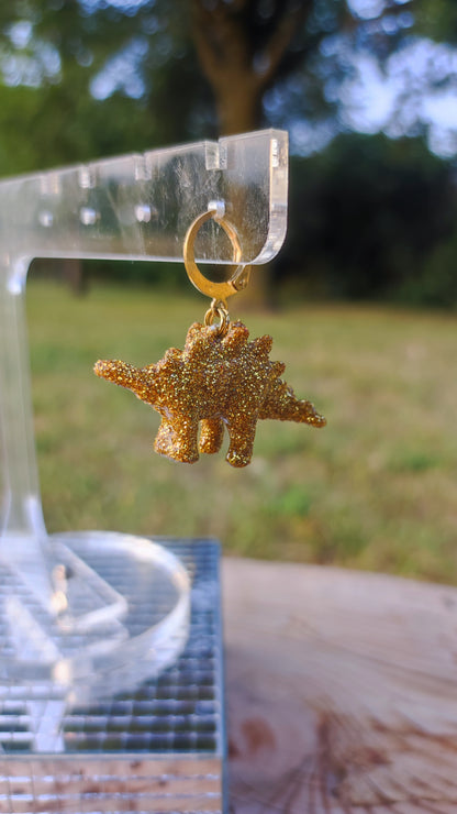 Mono boucle  - Mini dinosaure paillettes dorées (Stegosaure)